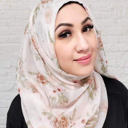 Floral hijab in a creamy offwhite color  with pink white and light brown flowers in a thin fabric perfect for summer hijab