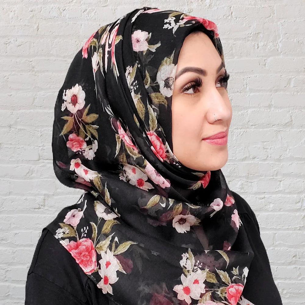 Floral hijab in black with pink red and white flowers in a thin fabric perfect for summer hijab